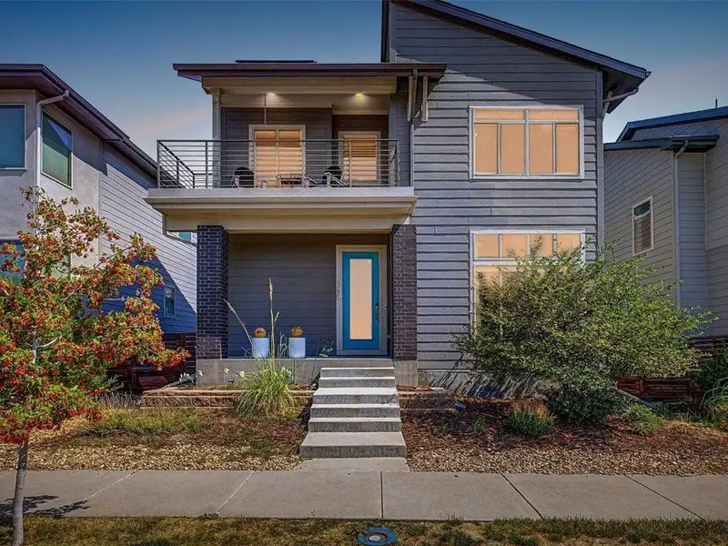 Modern two-story home with a balcony at 1365 West 67th Place in Denver, Colorado.